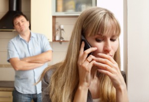 Wife confer privately on the phone