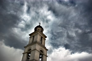 bell tower under dramatic skies